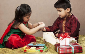 Sister Tying Rakhi to Brother - Bhakti Marg